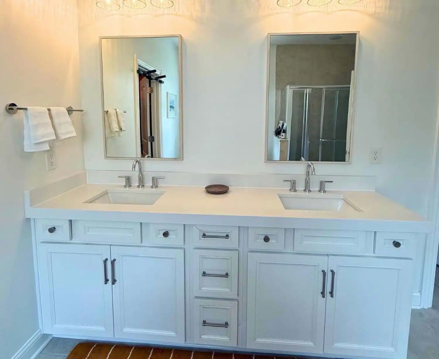 Original bathroom vanity - white double sink cabinet - framed mirrors - light countertop - Columbus Ohio