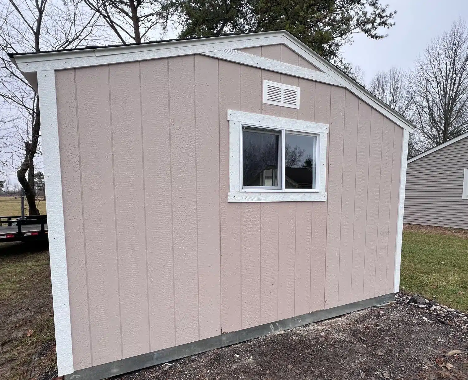 Custom-built shed in Columbus, Ohio with window and exterior siding