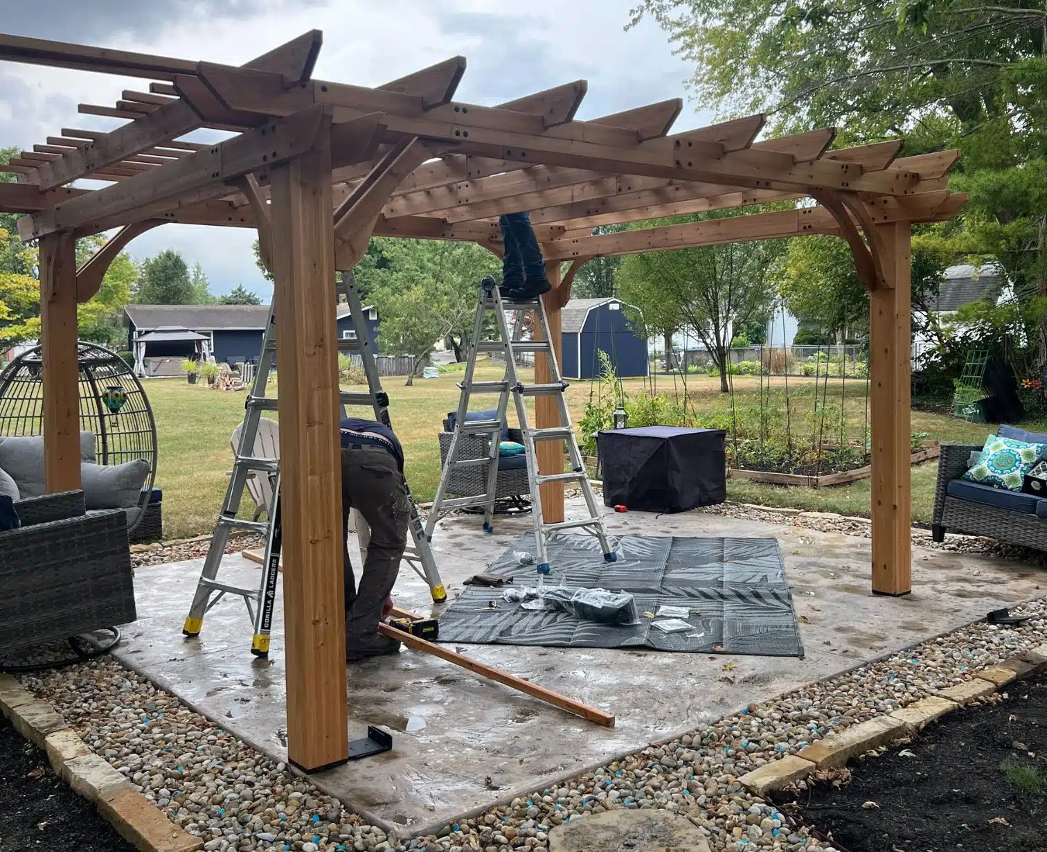 Pergola installation process with wooden beams and structure assembly