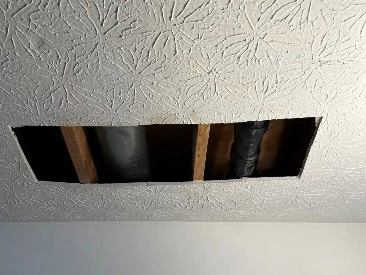 Before - textured ceiling with a clean finished surface before drywall ceiling repair begins