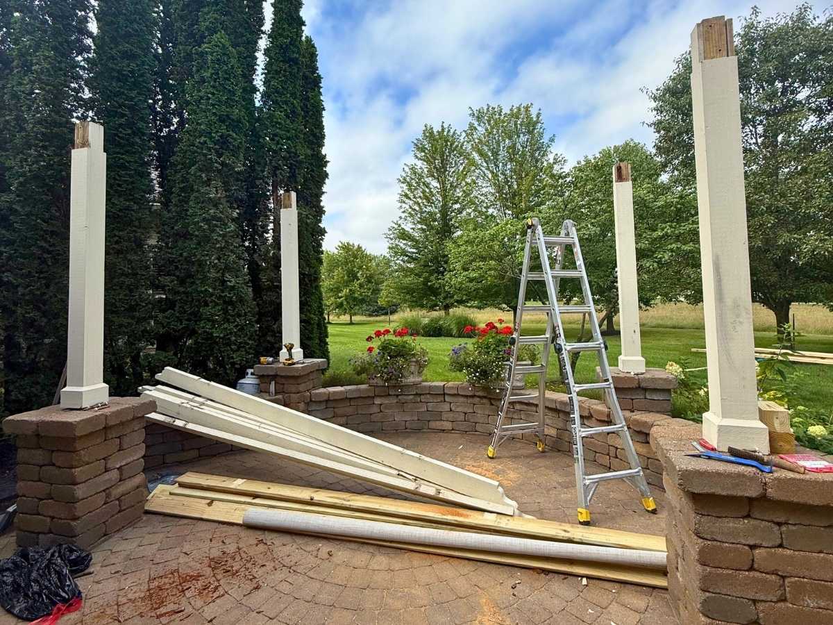 pergola installation in progress backyard columbus ohio contractors assembling wooden pergola structure