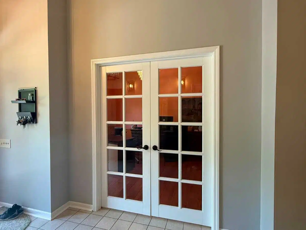 remodeled office with peach accent walls hardwood floors and furnished workspace