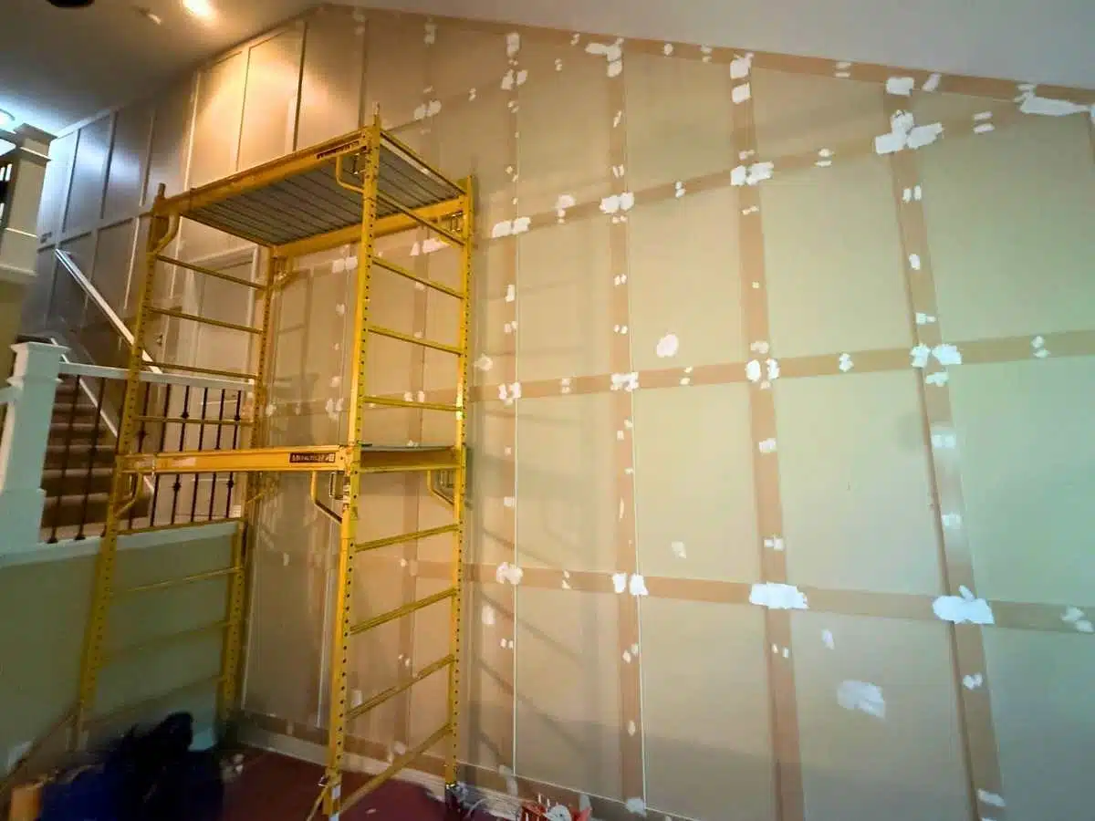 Board and batten accent wall during installation and preparation for painting